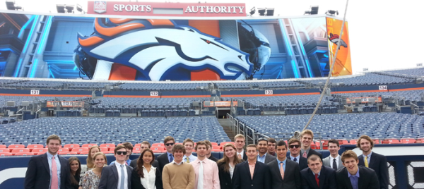 photo of a class standing on the field at Sports Authority Stadium